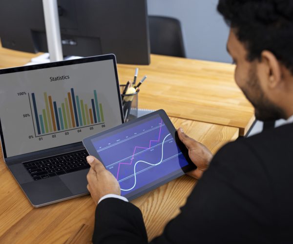 business-person-looking-finance-graphs business-person-looking-finance-graphs